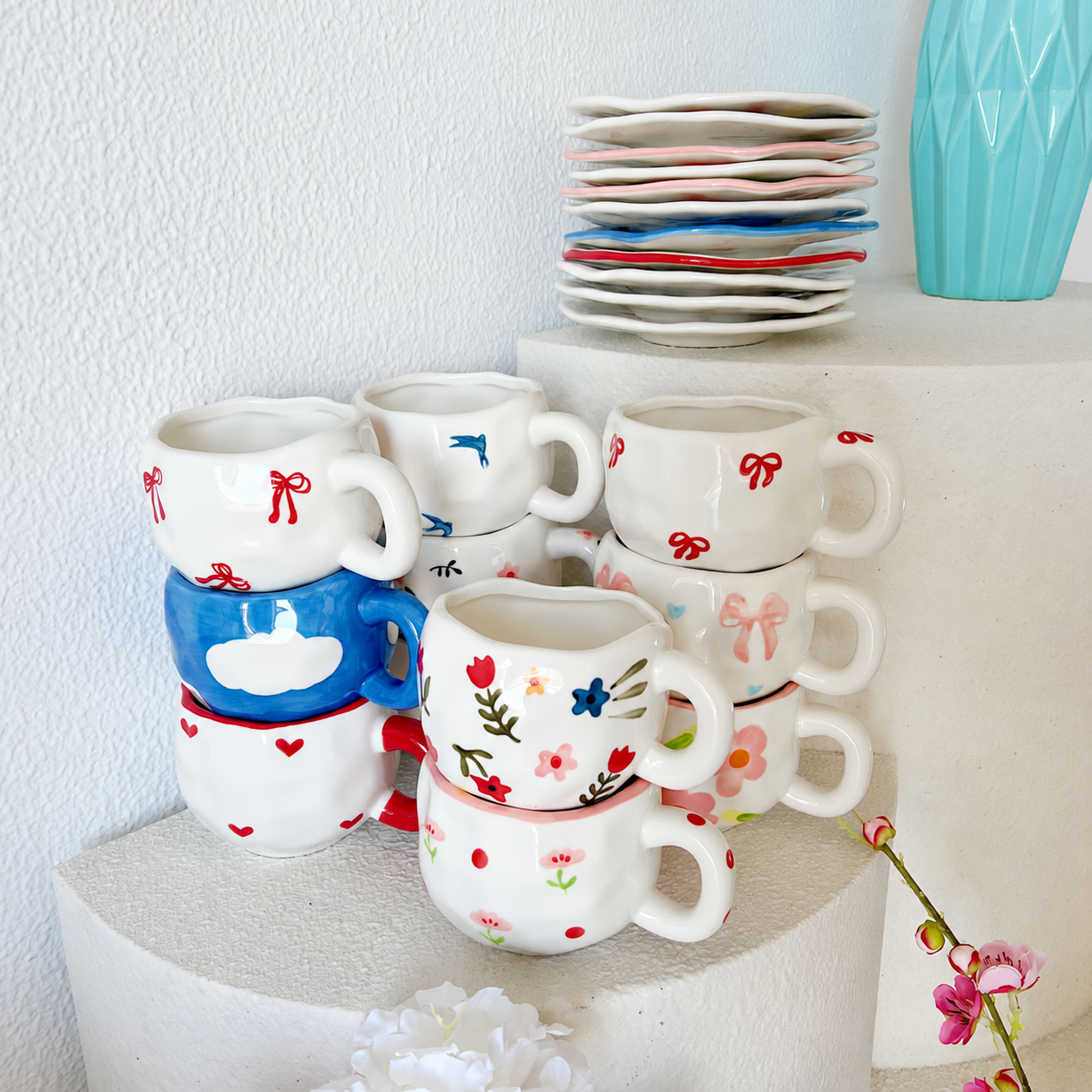 Stacked assortment of hand-painted ceramic cups