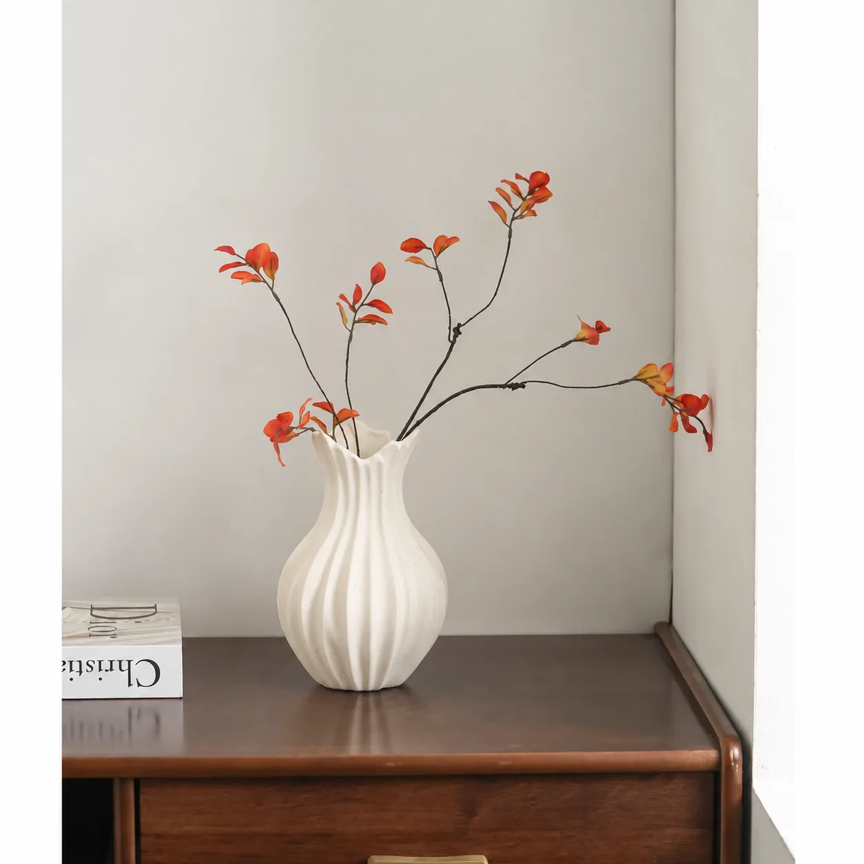 Ivory wabi-sabi ceramic vase with orange branches